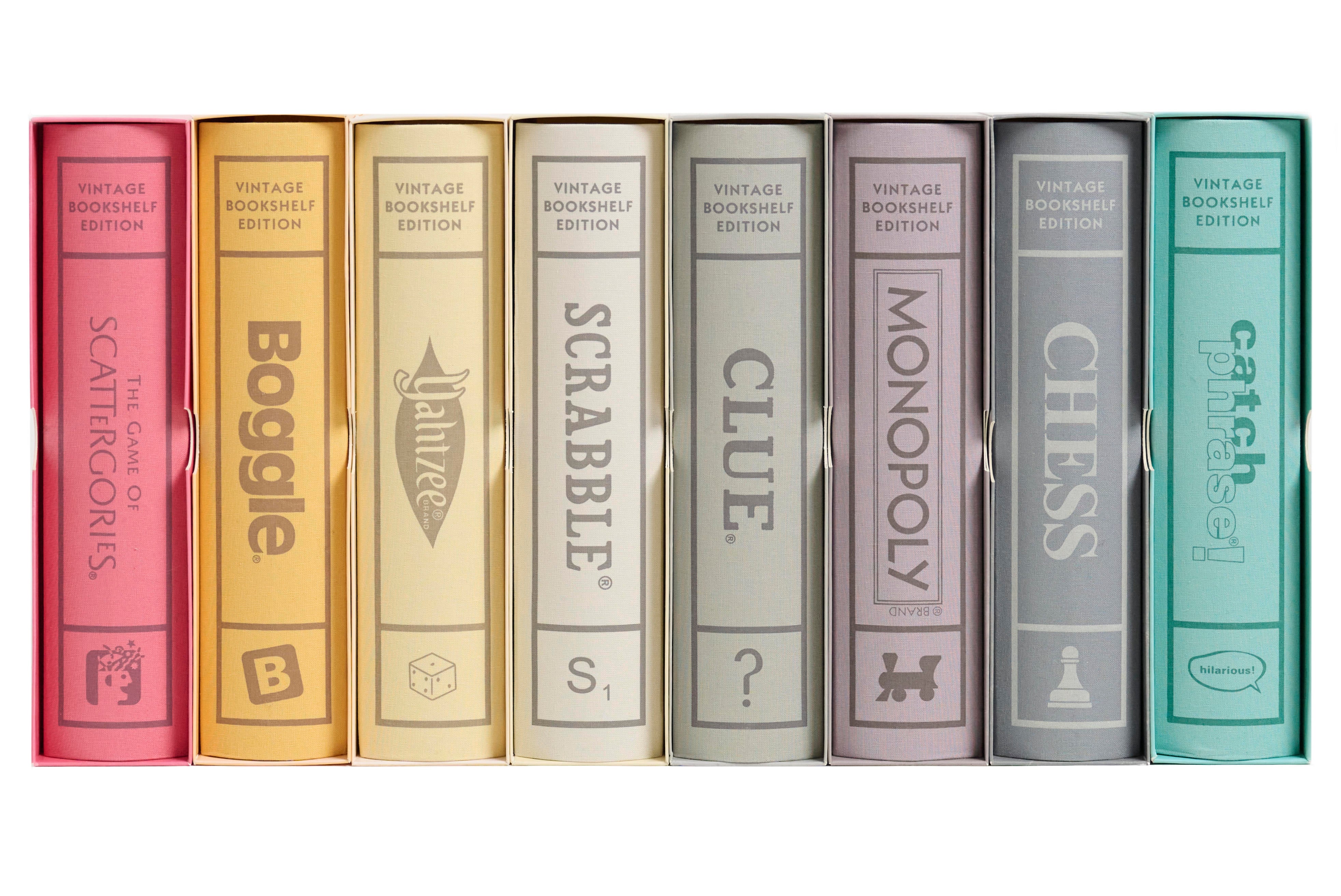 Eight Vintage Bookshelf Edition board games including Scrabble, Monopoly, Clue, and Yahtzee in colorful linen-wrapped cases.
