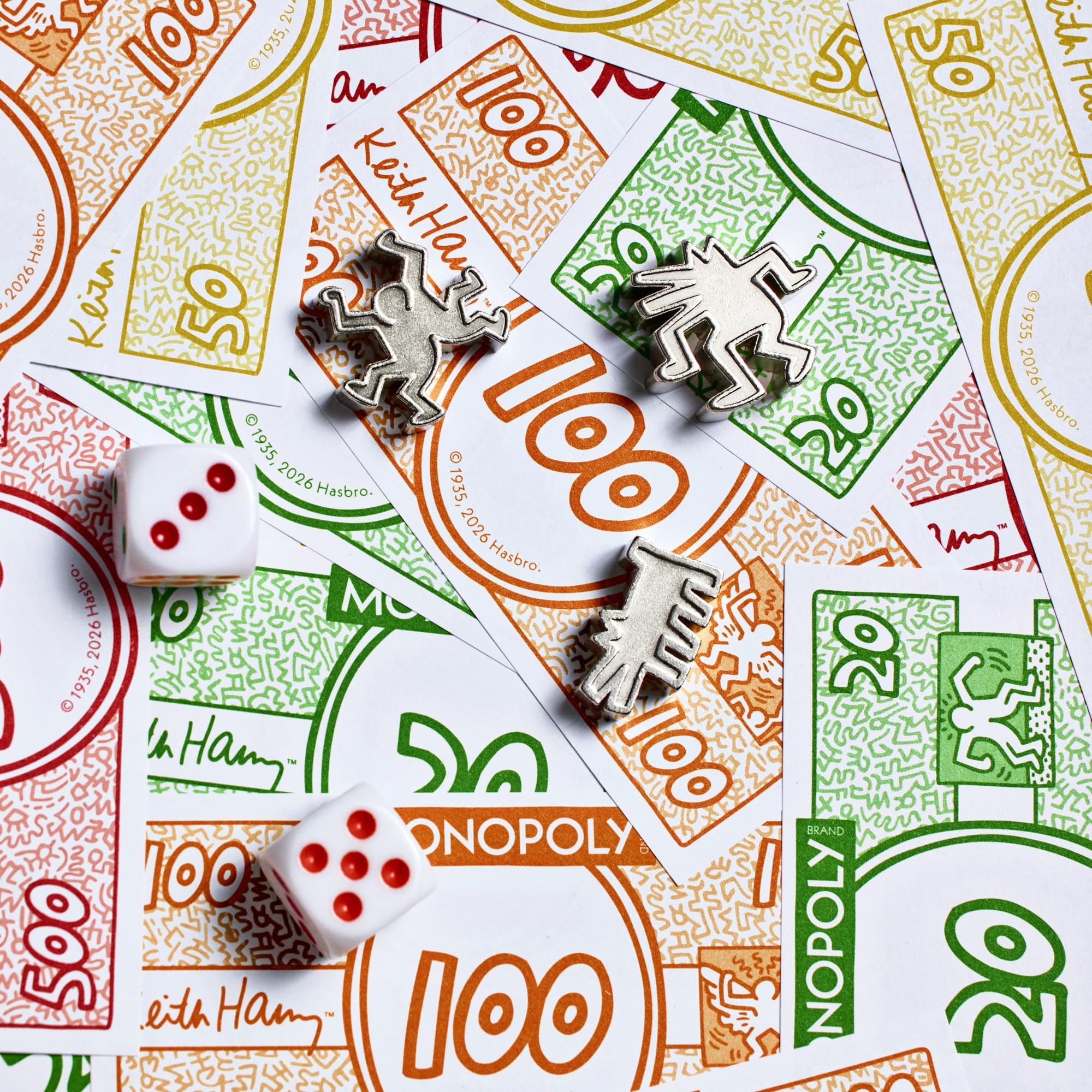 Close-up of Monopoly money and pieces on a Monopoly board