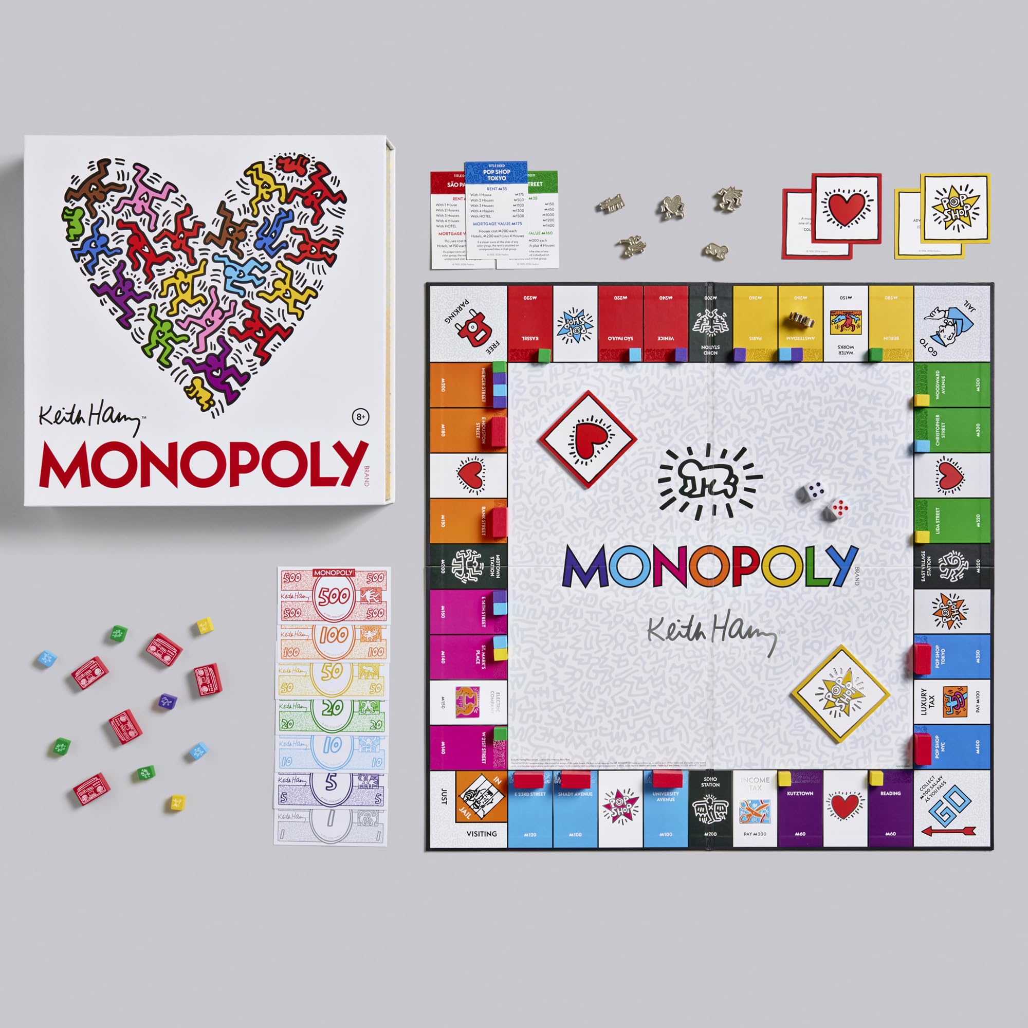 Keith Haring Monopoly game set with colorful board and pieces on a gray background